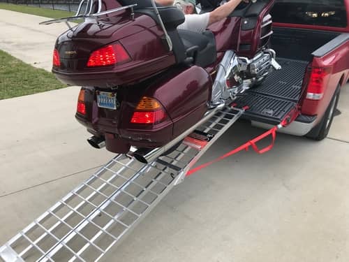 loading a motorycle in a pickup